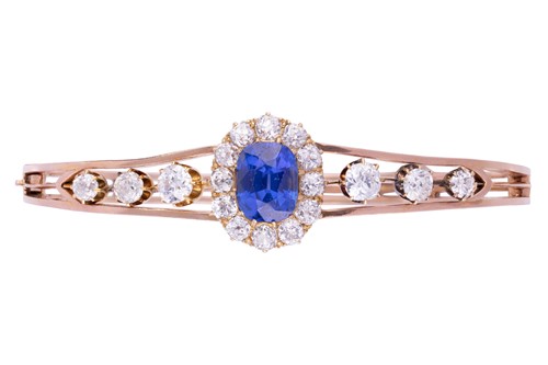 A Victorian Kashmir Sapphire (with no indications of heat treatment) and diamond cluster hinged bangle