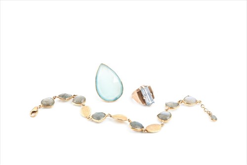 Lot 472 - A yellow metal and aquamarine ring in the Art...