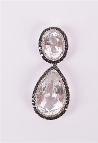 Lot 588 - An 18ct white gold, black diamond and gemstone...