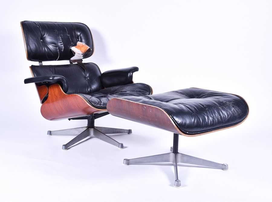 Lot 33 - An Eames-style lounge chair and matching...
