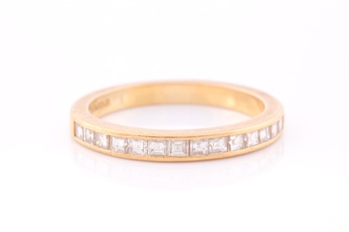 Lot 163 - An 18ct yellow gold and diamond half-eternity...