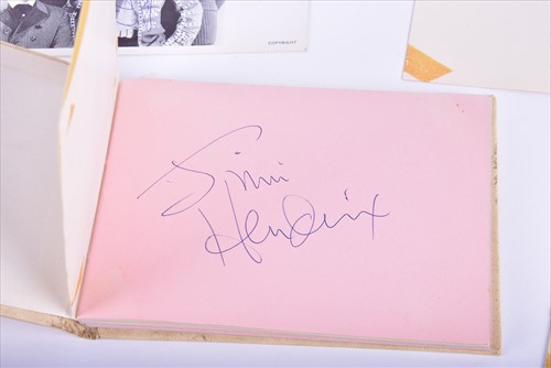 Lot 329 - Jimi Hendrix: an autograph book containing two...