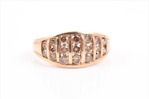 Lot 617 - A 9ct yellow gold and cognac diamond ring the...