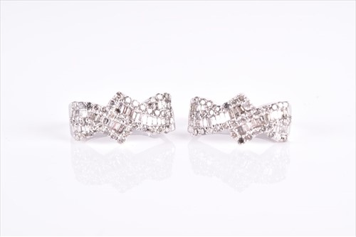 Lot 531 - A pair of diamond earrings the double...