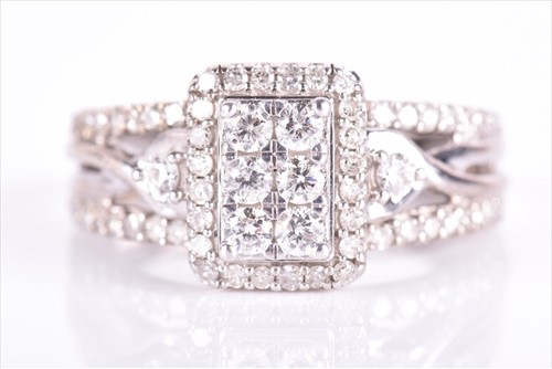 Lot 616 - A white metal and diamond ring set with a...