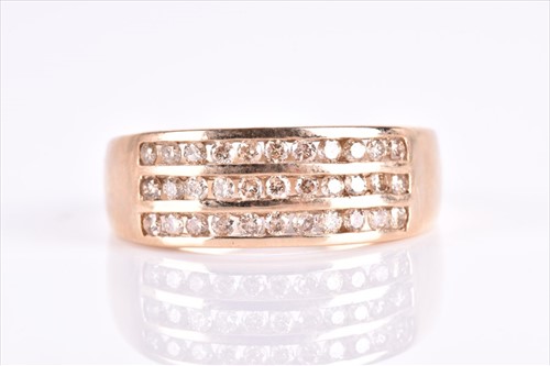Lot 617 - A 9ct yellow gold and cognac diamond ring...
