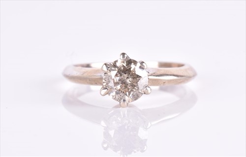 Lot 579 - A solitaire diamond ring set with a...