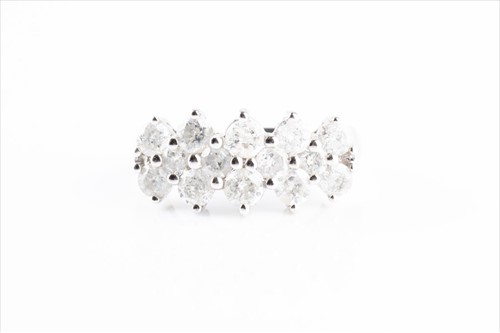 Lot 390 - A white metal and diamond ring set with...