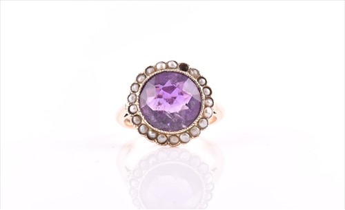 Lot 575 - A 9ct yellow gold, amethyst, and split seed...