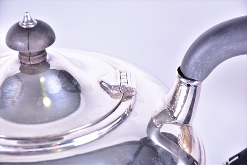 Lot 391 - A George V period silver teapot and coffee pot...