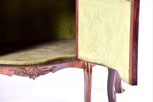 Lot 12 - A large Louis XV style serpentine front...