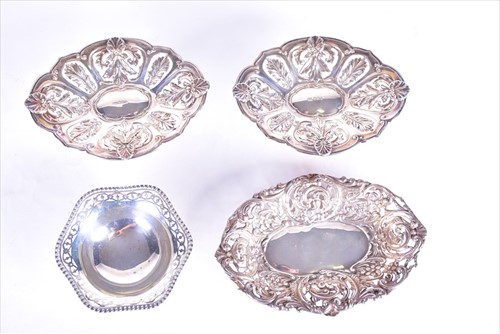Lot 402 - A pair of George V silver pierced dishes...