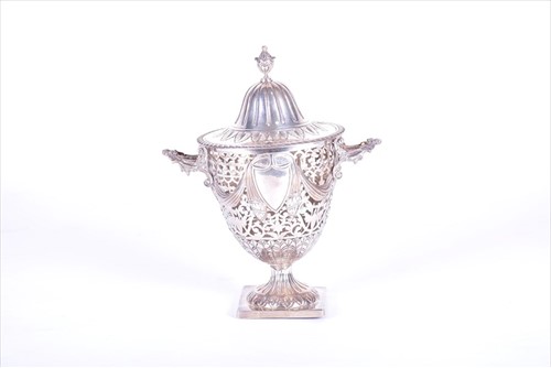 Lot 397 - An Edwardian silver hinge-lidded sugar carrier...