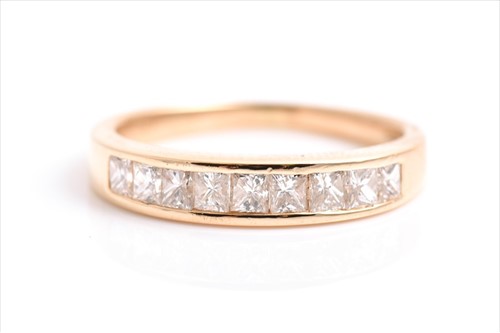 Lot 694 - An 18 carat gold princess cut diamond half...