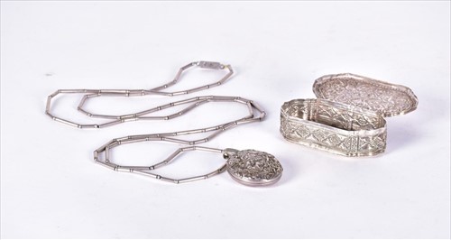 Lot 436 - An Eastern white metal box of shaped oval form...