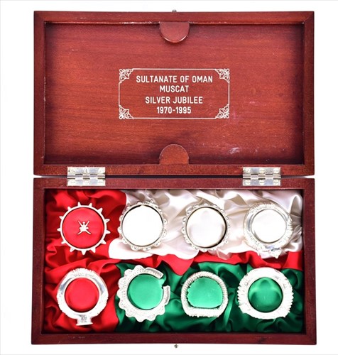 Lot 439 - A set of eight cased silver Dhofari napkin...