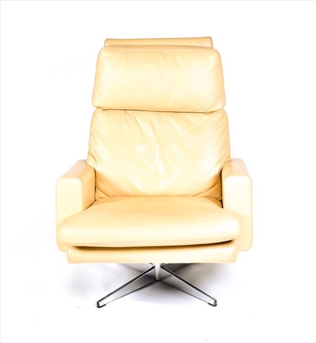 Lot 56 - A 1970s mushroom leather upholstered swivel...