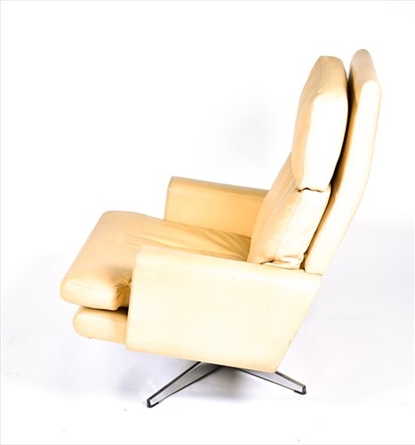 Lot 56 - A 1970s mushroom leather upholstered swivel...