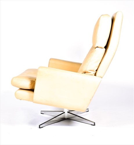 Lot 56 - A 1970s mushroom leather upholstered swivel...