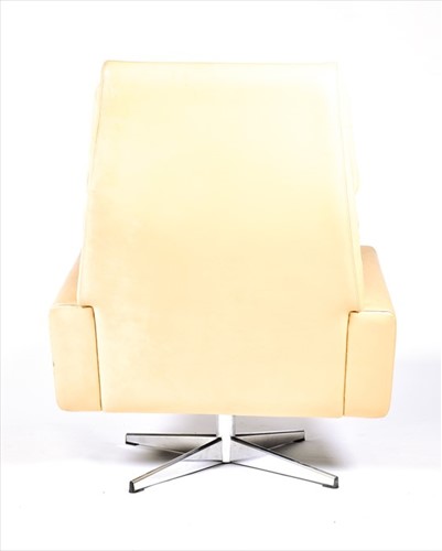 Lot 56 - A 1970s mushroom leather upholstered swivel...