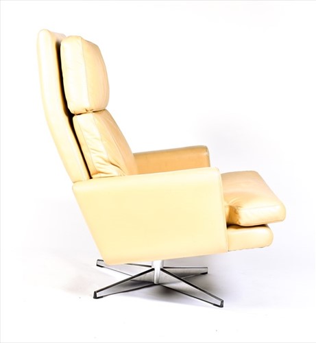 Lot 56 - A 1970s mushroom leather upholstered swivel...