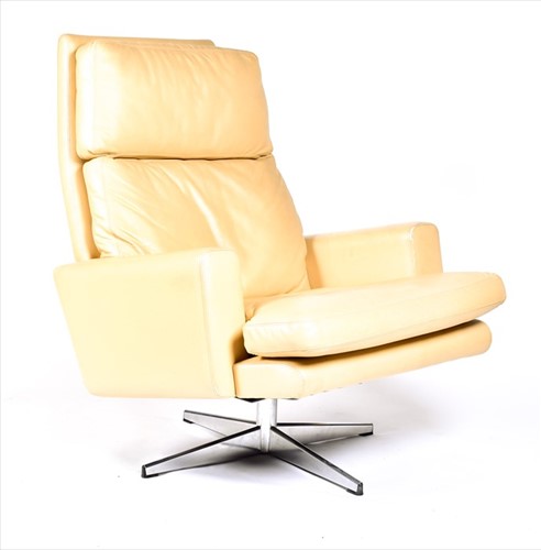 Lot 56 - A 1970s mushroom leather upholstered swivel...