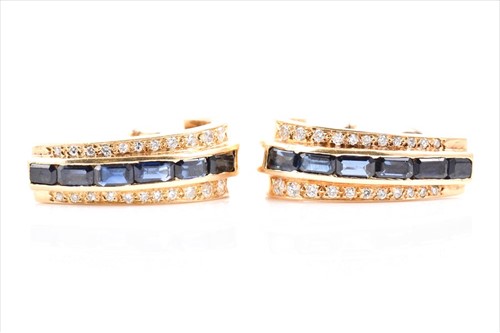 Lot 627 - A pair of 18 carat yellow gold, diamond, and...