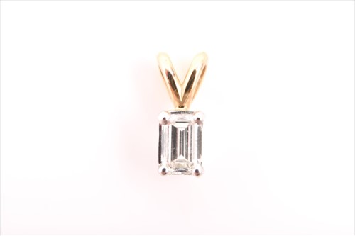 Lot 625 - An emerald-cut diamond pendant the yellow and...