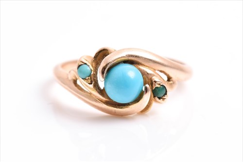 Lot 616 - A yellow metal and turquoise crossover ring in...