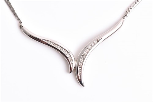 Lot 638 - A 9ct white gold and diamond necklace the...