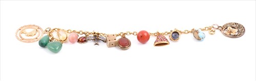 Lot 651 - An unusual yellow metal charmÂ bracelet...