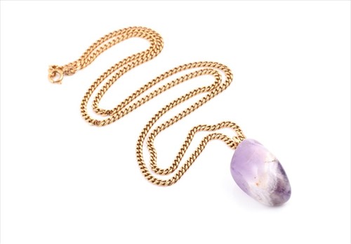 Lot 646 - A yellow metal mounted amethyst pendant of...
