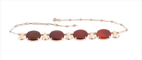 Lot 644 - An unusual yellow metal and carnelian necklace...