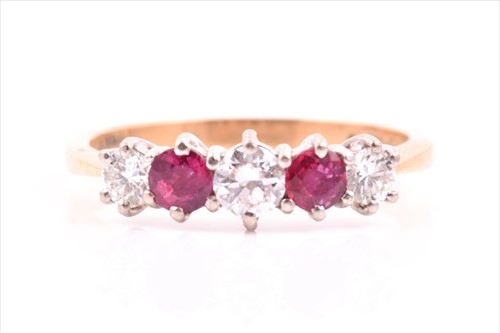 Lot 535 - An 18ct yellow gold, diamond, and ruby ring...