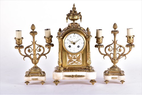 Lot 329 - A Louis XVI style gilt metal and marble clock...