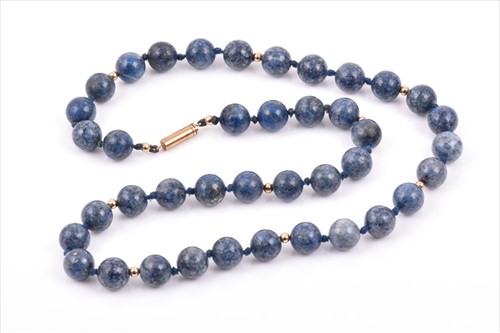 Lot 503 - A lapis lazuli necklace comprised of...