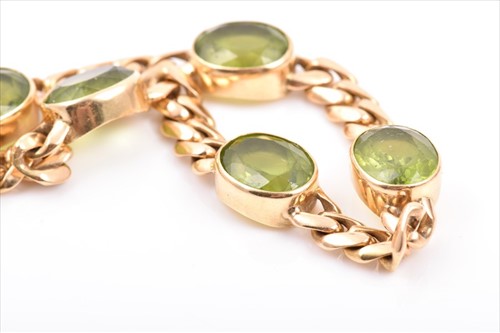Lot 741 - An 18ct yellow gold and peridotÂ bracelet the...