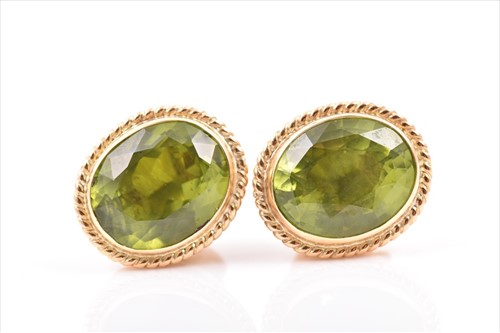 Lot 498 - A pair of 14ct yellow gold and peridot...