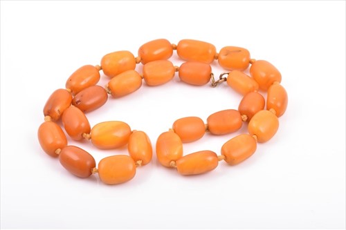 Lot 509 - An amberÂ beaded necklace comprised of various...