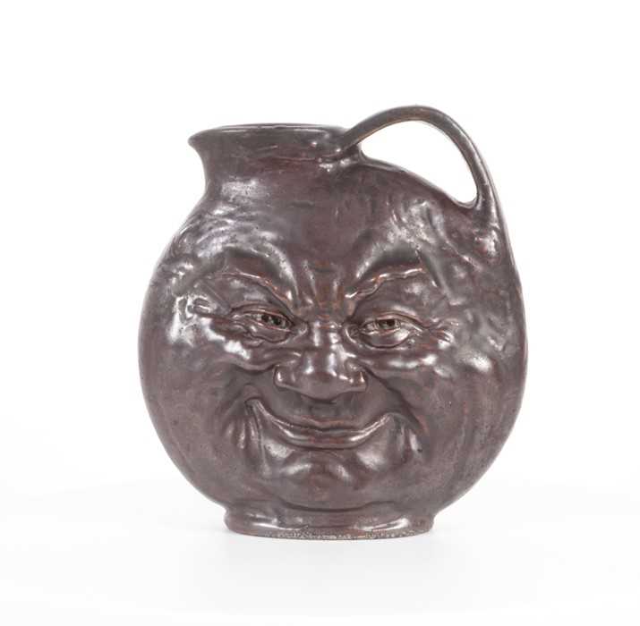 Lot 201 - An early 20th century Martin Brothers tall...
