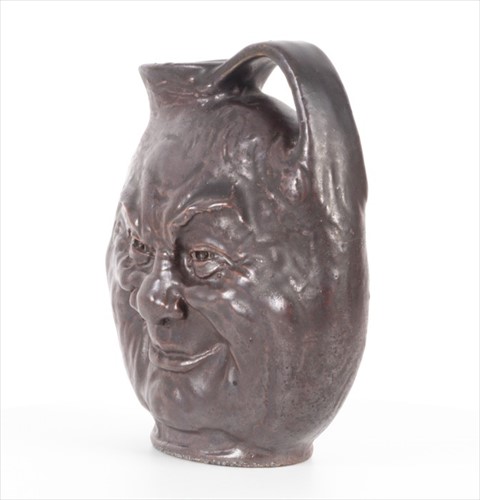 Lot 201 - An early 20th century Martin Brothers tall...