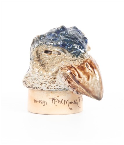Lot 238 - A Martin Brothers stoneware bird jar cover...
