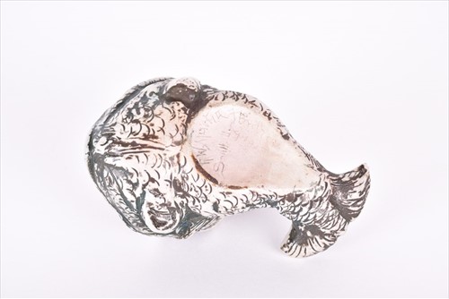 Lot 241 - A Martin Brothers spoonwarmer modelled as a...