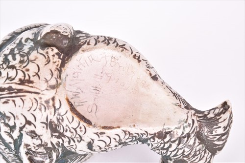 Lot 241 - A Martin Brothers spoonwarmer modelled as a...