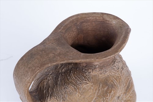 Lot 202 - A Martin Brothers double-sided stoneware face...