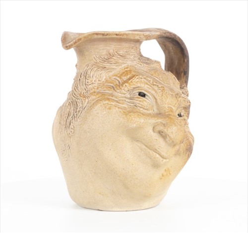 Lot 202 - A Martin Brothers double-sided stoneware face...
