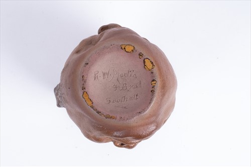 Lot 203 - A Martin Brothers double-sided stoneware face...