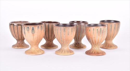 Lot 219 - A matched group of seven Martin Brothers egg...