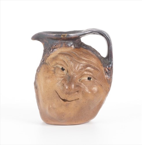 Lot 247 - A Martin Brothers double-sided small stoneware...