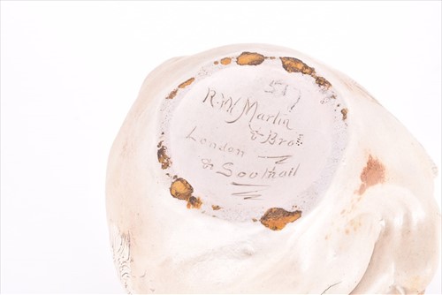Lot 249 - A Martin Brothers large double-sided stoneware...